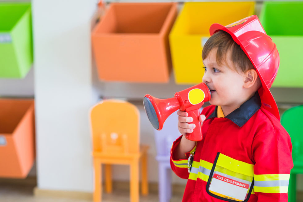 Kid in a Firefighter costume